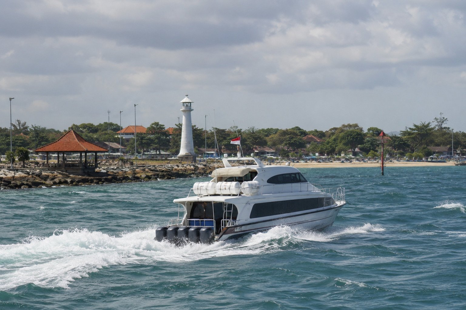 Fast boat leaving Sanur Harbour in rougher sea conditions
